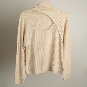 Venus Cream turtle neck sweater with cut out